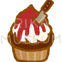 ナイフの飾りが乗ったハロウィンのカップケーキのイラスト