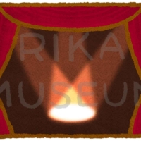 スポットライトの当たる劇場のステージのイラスト